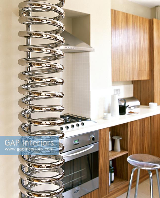 Spring shaped radiator in modern kitchen 