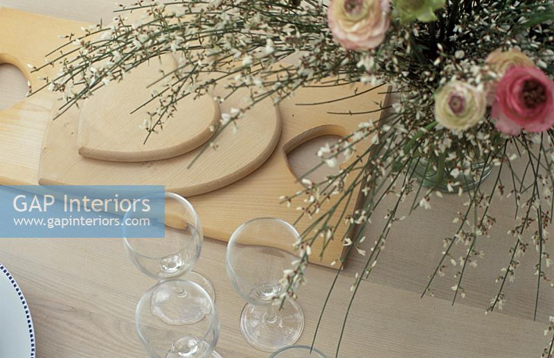 Flowers and accessories on modern dining table