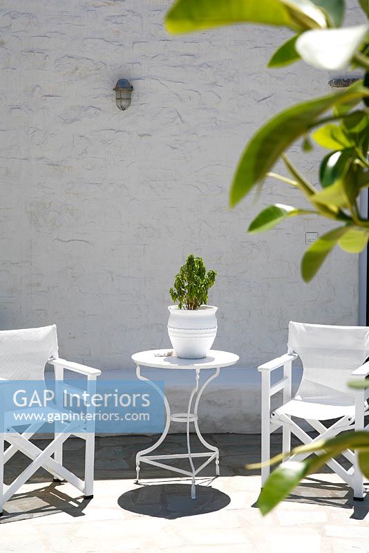 Garden furniture on paved terrace 