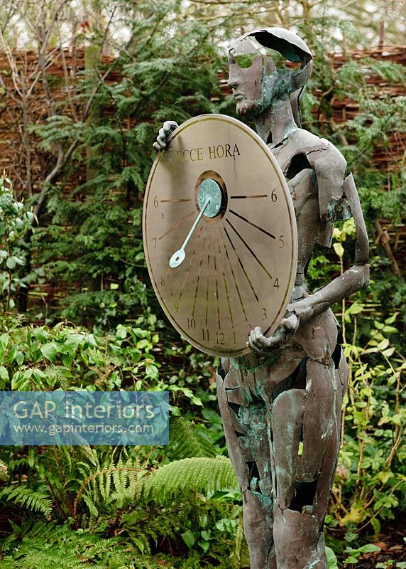 Sculpture in country garden 