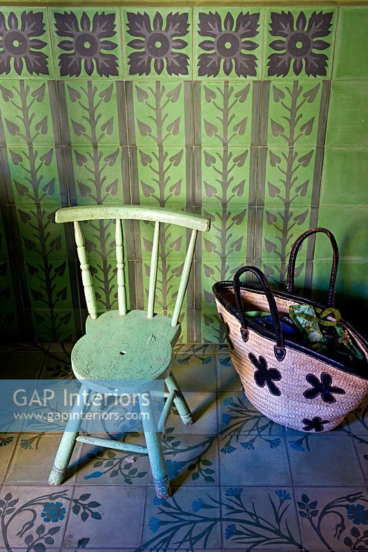 Vintage chair on decorative tiled floor 
