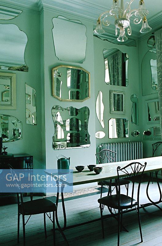 Display of mirrors on dining room wall 