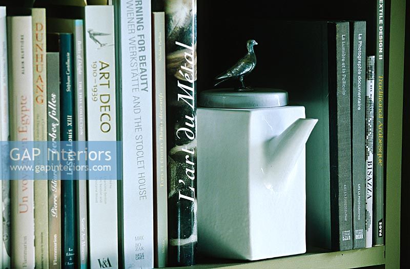 Detail of teapot on bookshelf 