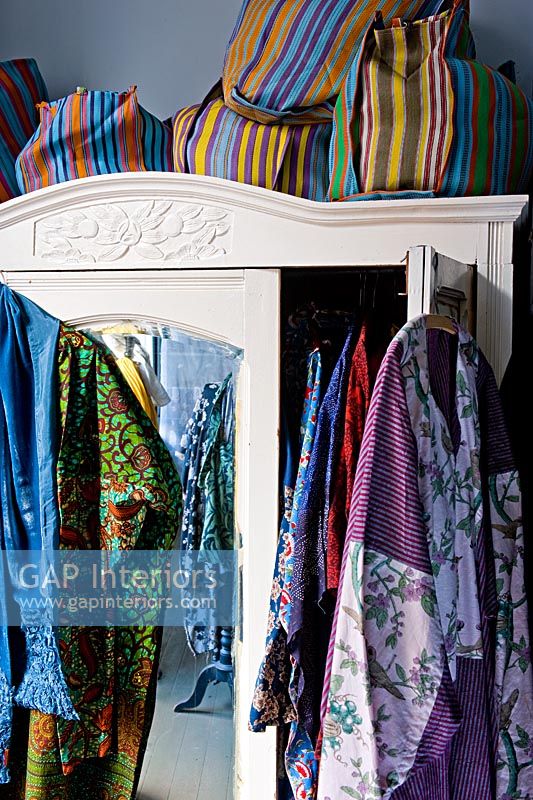 Wardrobe and brightly coloured clothes