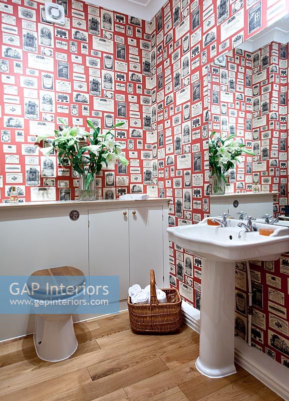 Modern bathroom with patterned wallpaper 