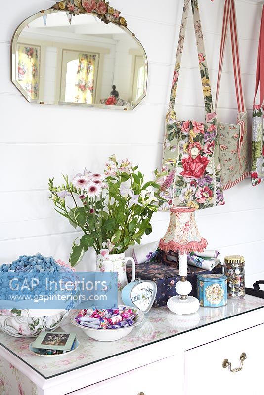 Flowers and accessories on cabinet