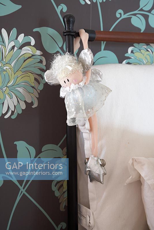 Detail of fairy hanging from bed frame