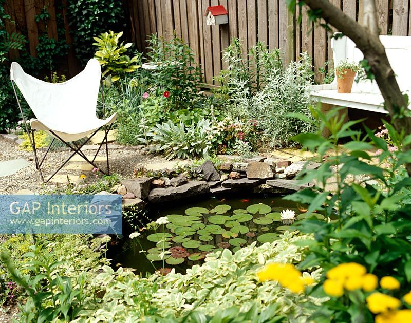 Garden seating around ornamental pond 