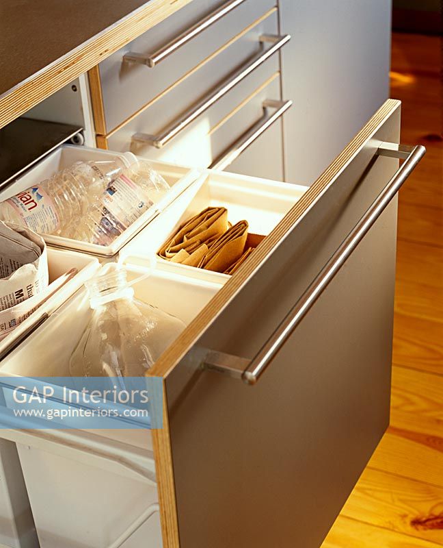 Recycling drawer in modern kitchen 
