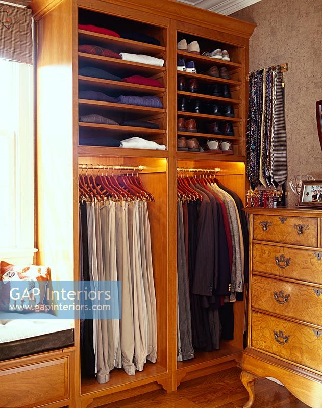 Wardrobe and shelves in classic bedroom 