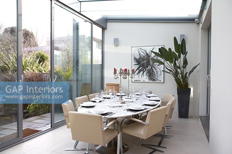 Modern dining table and chairs in conservatory