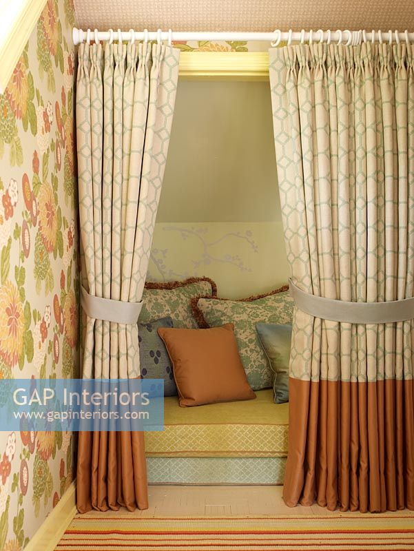 Snug seating area behind curtains 