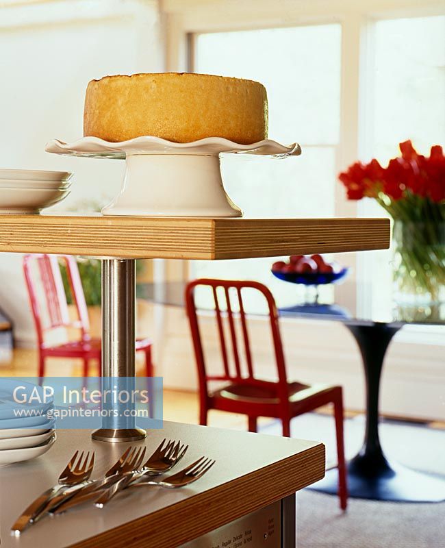 Cake on stand in modern dining room 