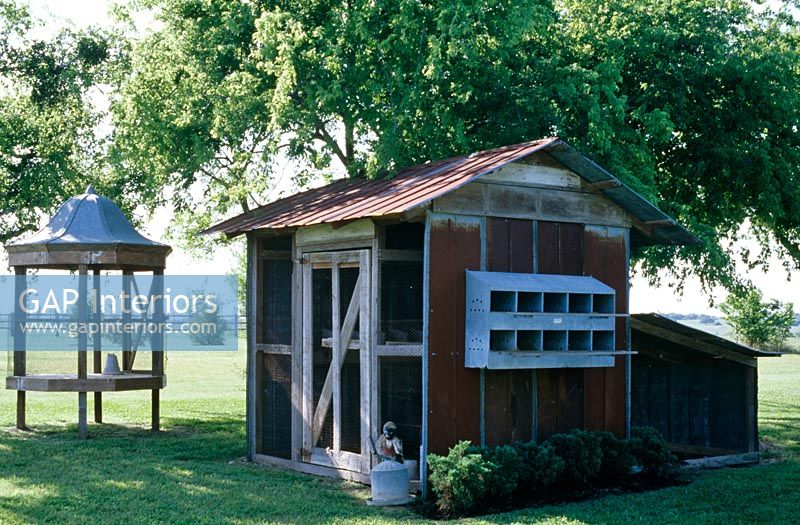 Exterior of wooden shed and garden seat