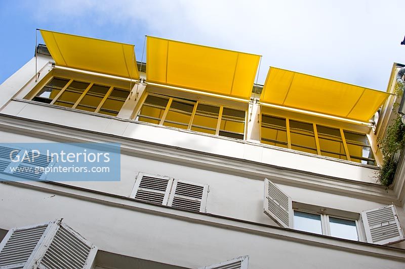 Exterior with yellow awnings