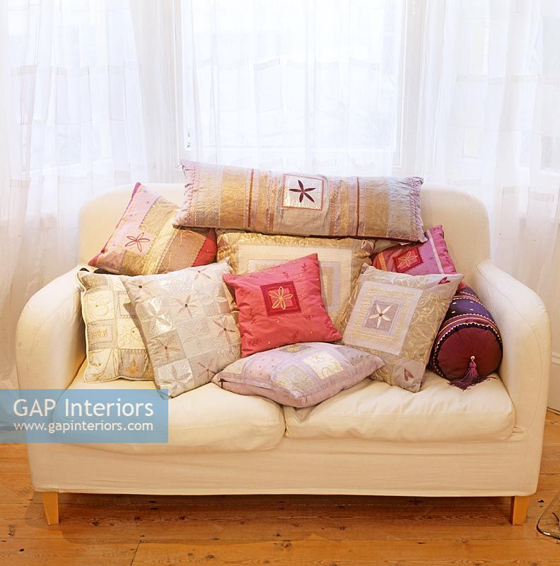Sofa full of patterned cushions
