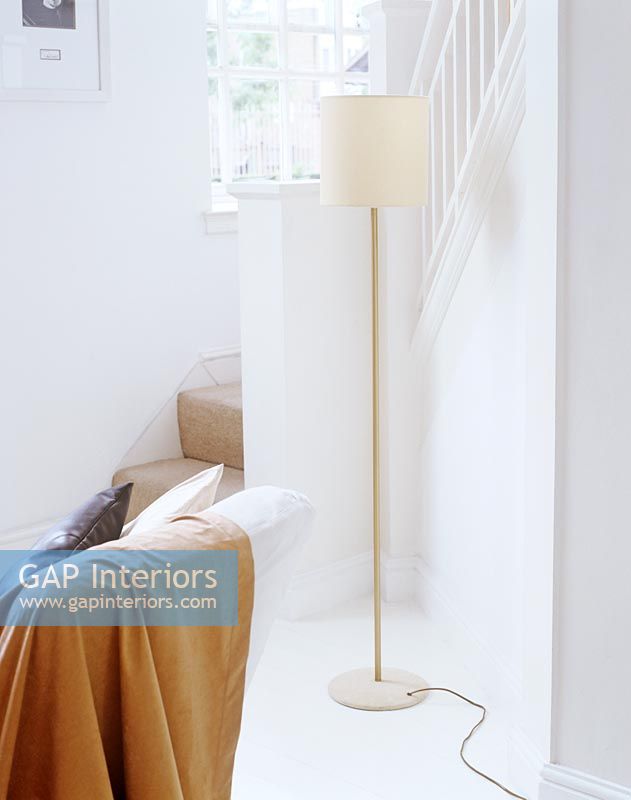 Floor lamp by staircase 