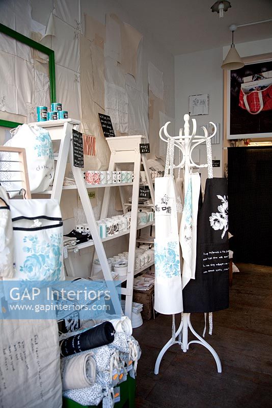 aprons and accessories on display in shop 