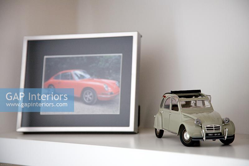Detail of vintage toy car and photograph