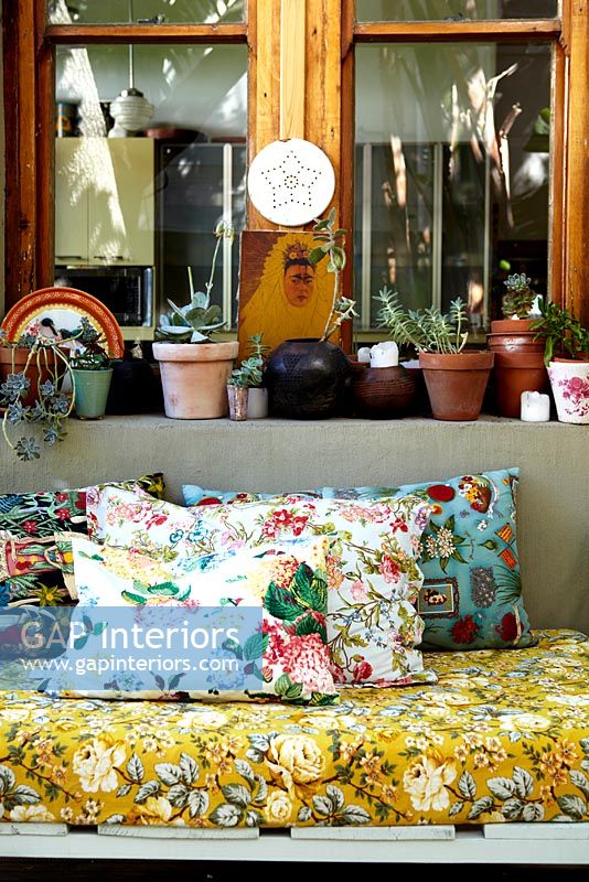 Detail of floral cushions on sofa 
