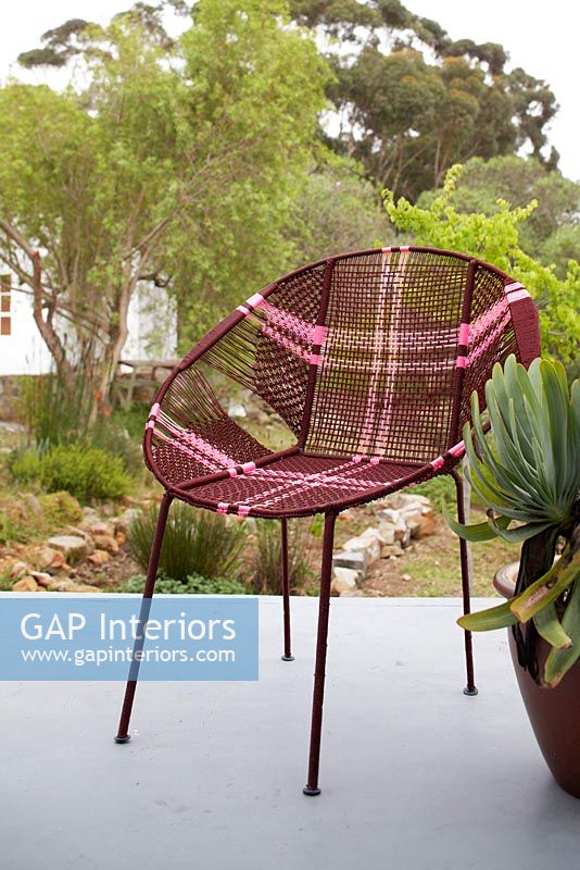 Patterned garden chair on terrace 