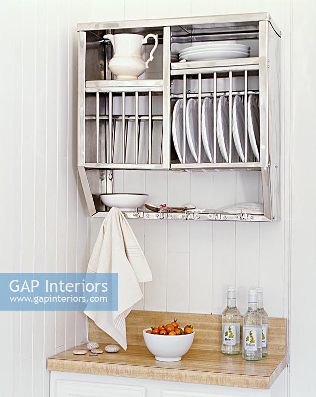 Plate rack on country kitchen wall 