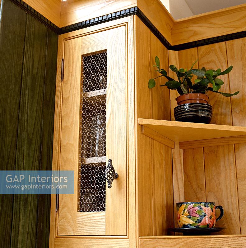 Detail of wooden kitchen unit and shelves 