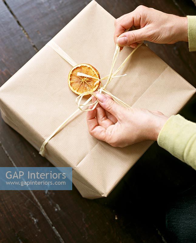 Detail of someone wrapping a Christmas present