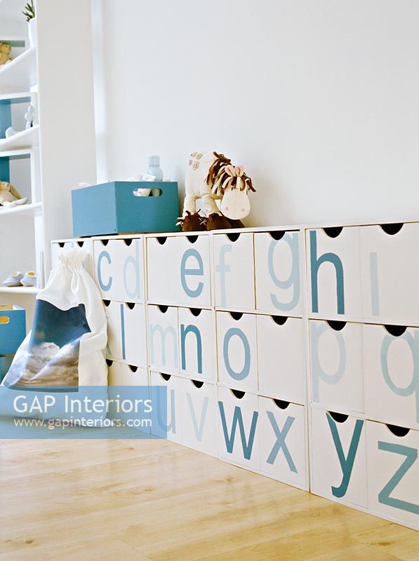 Childrens room with alphabet drawers 