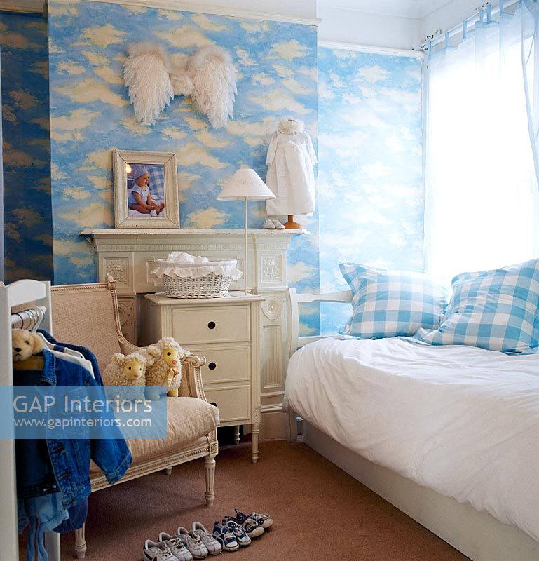 Childrens room with cloud wallpaper 