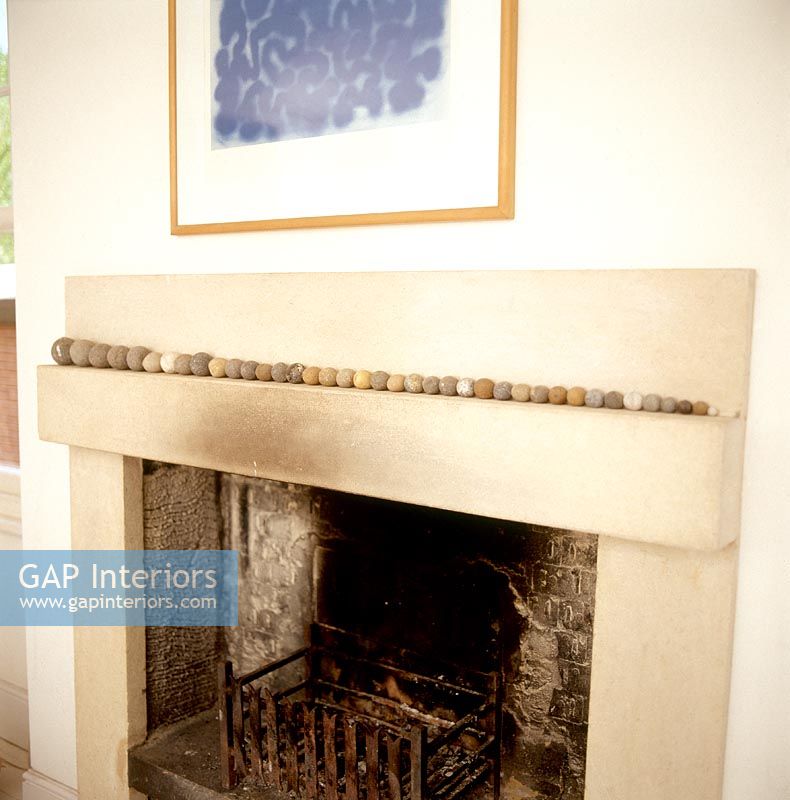 Display of pebbles on fireplace 