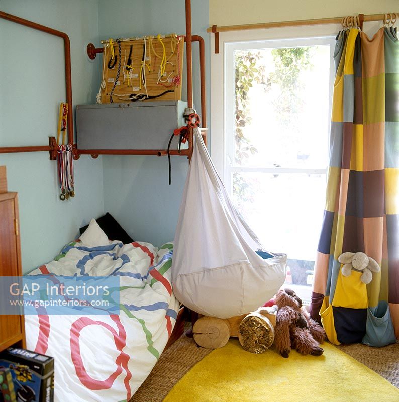 Modern childrens bedroom with exposed pipework