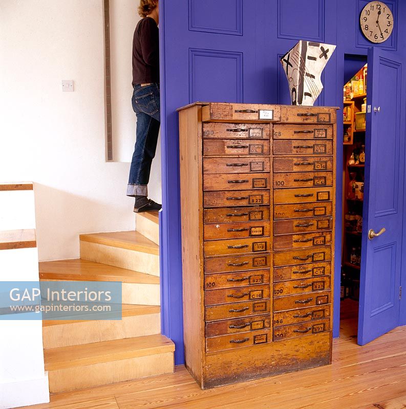 Reclaimed chest of drawers in modern hallway 