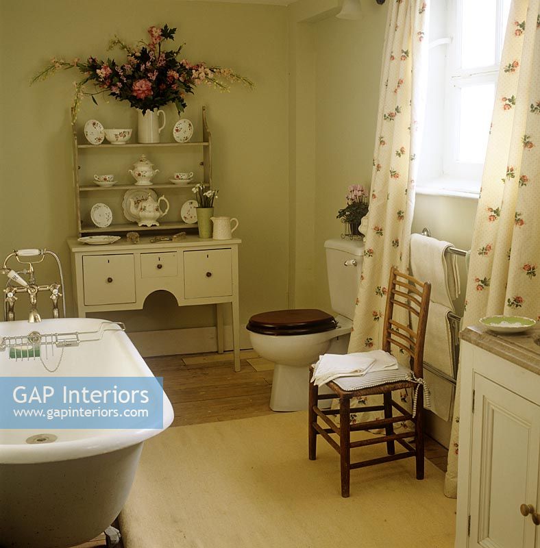 Country bathroom with display of crockery 