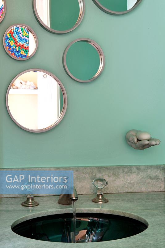 Display of mirrors over bathroom sink 