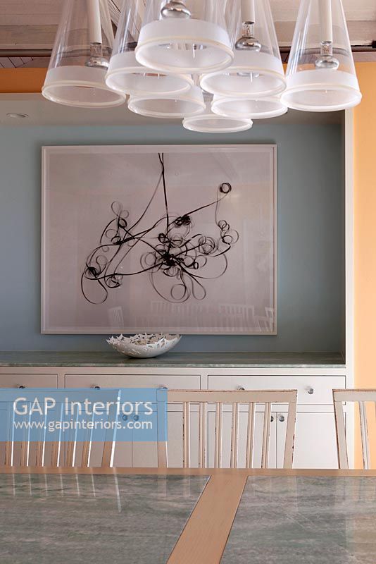 Modern painting on dining room wall 