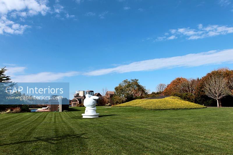 Large lawn with modern sculpture 