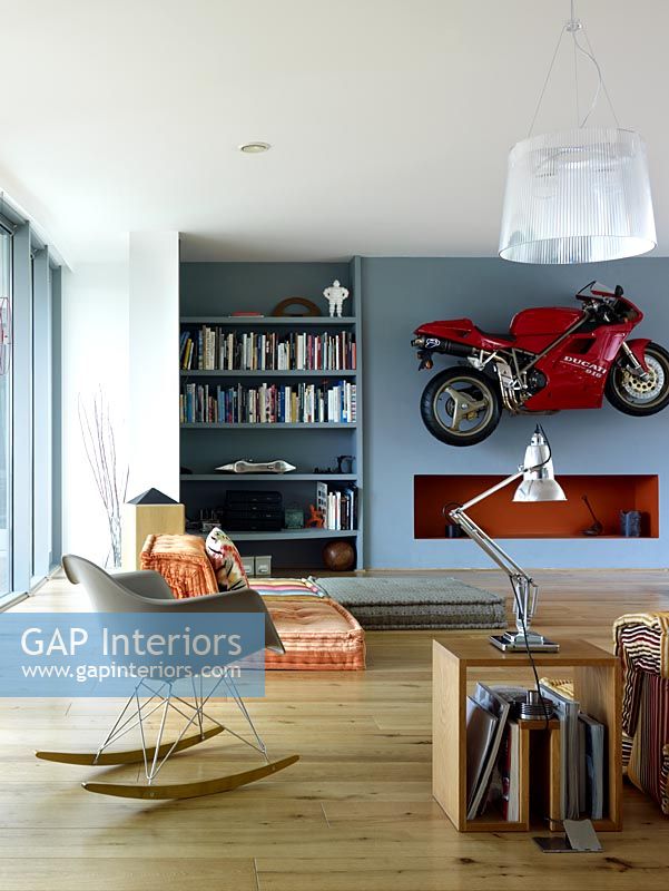 Motorbike on wall of eclectic living room