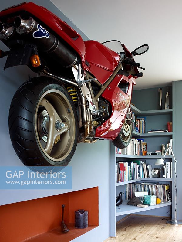 Wall mounted motorbike in modern living room 