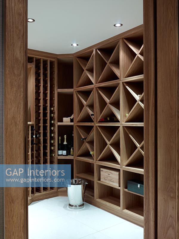 Wooden shelves in modern wine cellar 