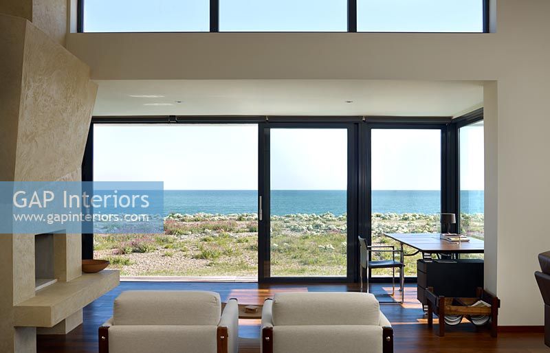 Living room with open patio doors to beach 