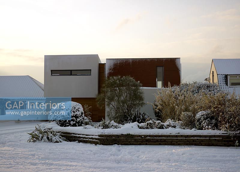 Exterior of contemporary house in the snow 