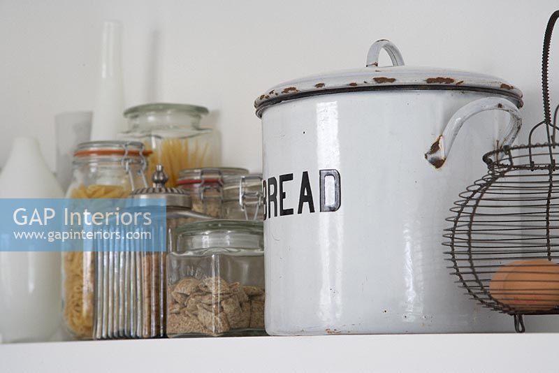 Vintage bread bin and storage jars on shelf