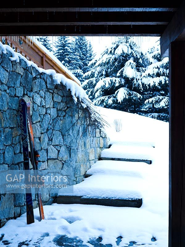 Ski equipment against exterior wall 