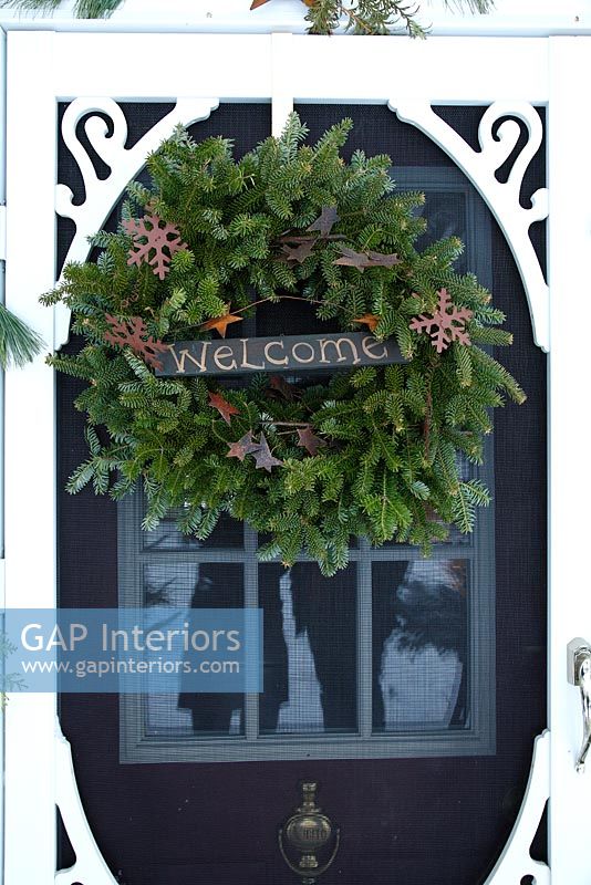 Christmas wreath on country front door 