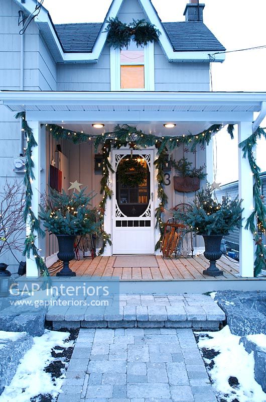 Country porch decorated for Christmas 