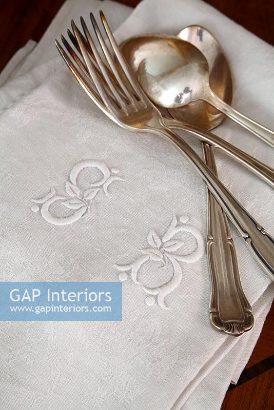 Detail of napkins and silver crockery 
