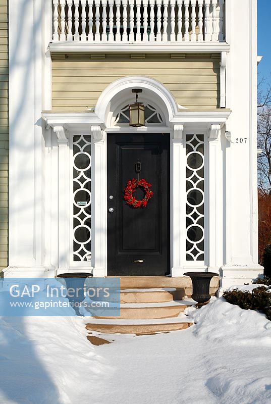 Classic front door decorated with wreath 