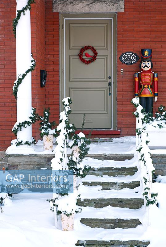 Carved toy soldier on Classic front porch 