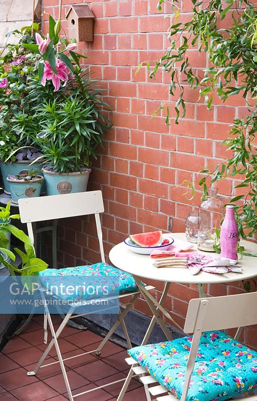 Cafe style table and chairs on terrace 